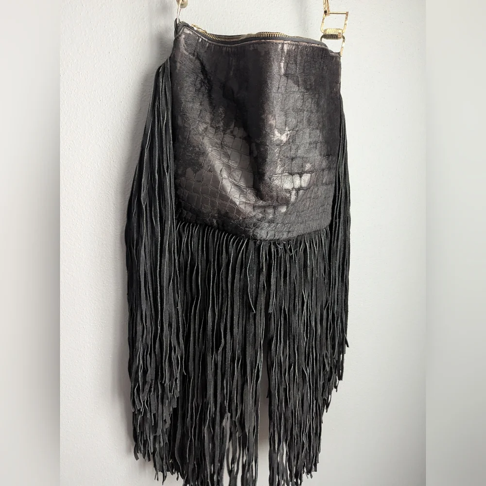 Black leather Fringe crossbody bag feels like cow leather. No tags. No brand tag